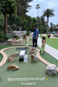 Influencer stay playing mini golf