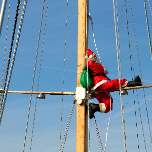 Santa sitting on a sail