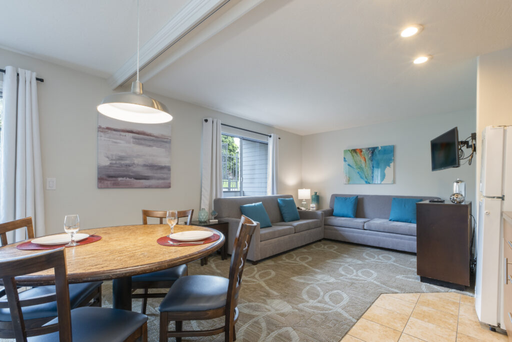 Living room and dining room with a couch and a table